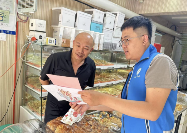 大彩配资 仙营街道秦庄社区开展运河大集+普法宣传活动